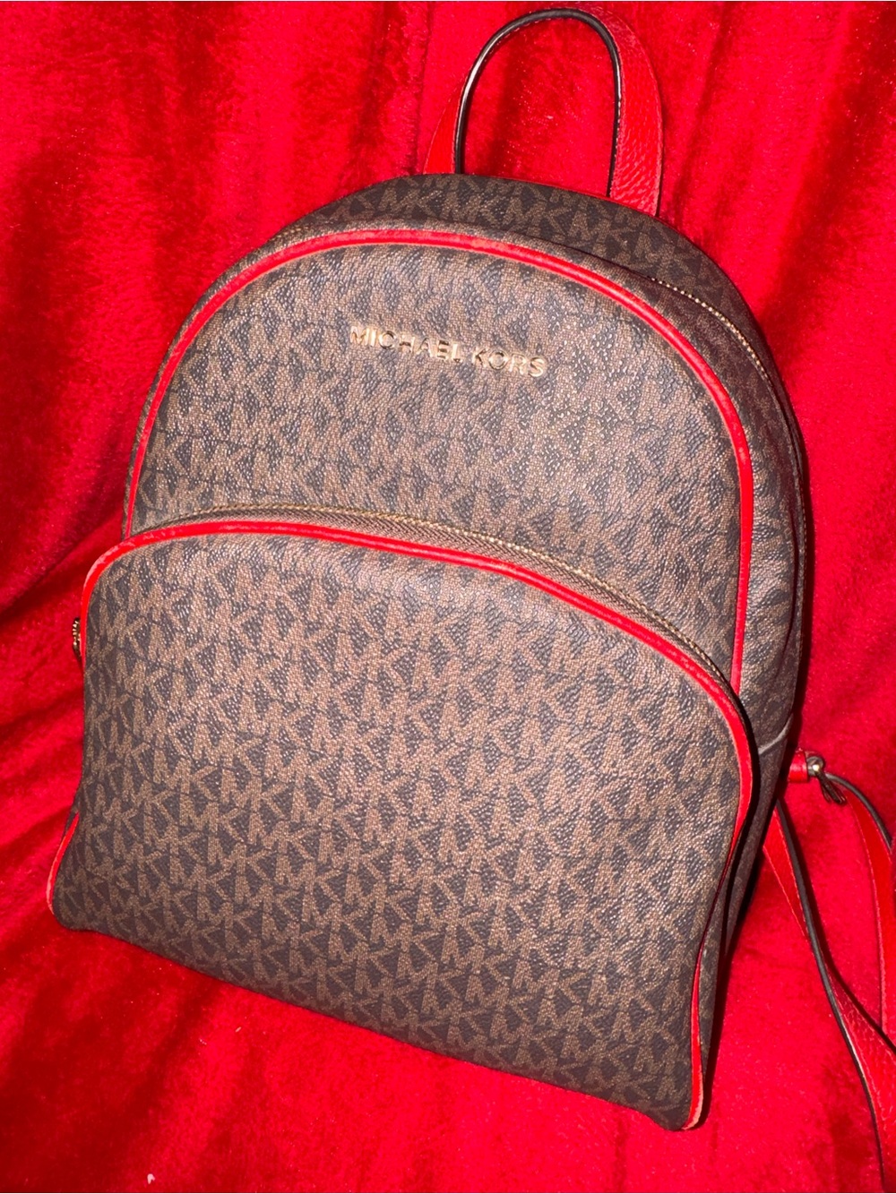 Michael Kors Brown Monogram Backpack with Red Trim and Gold Logo